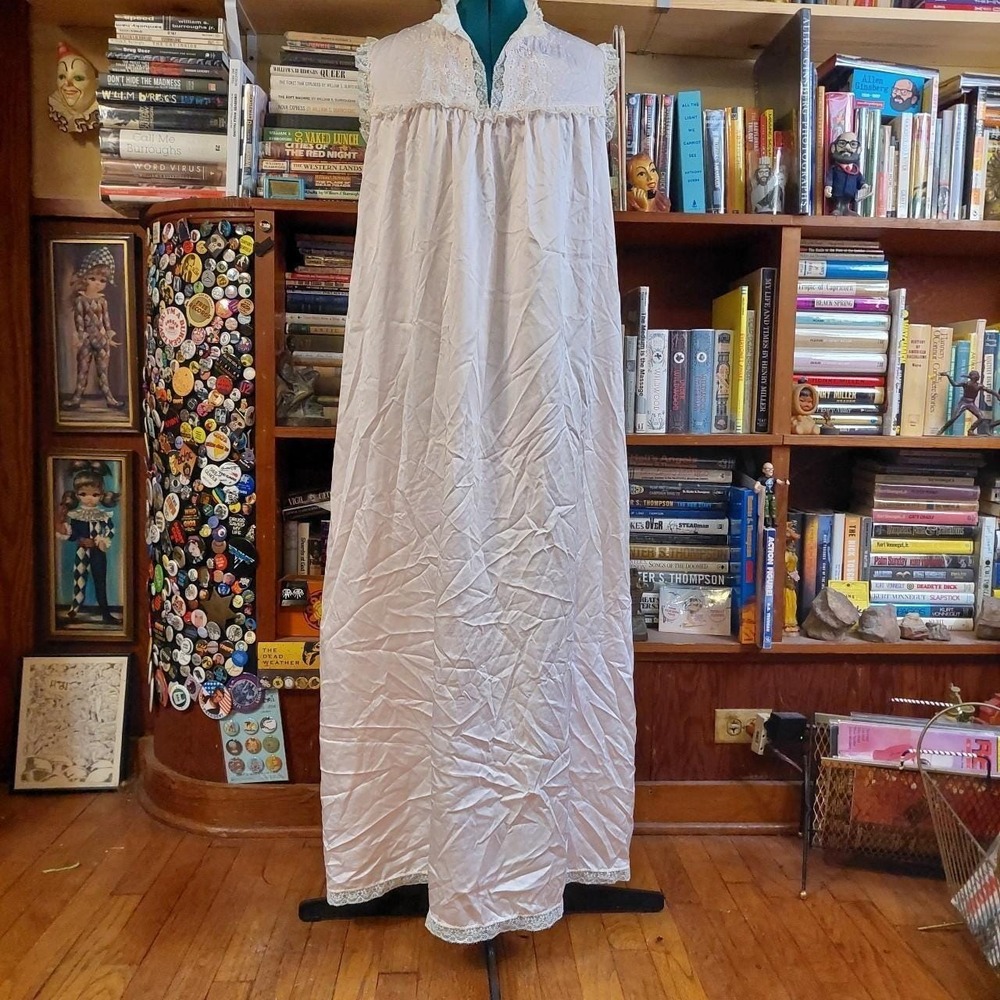 Vintage baby pink long slip with white embroidered and lace details.